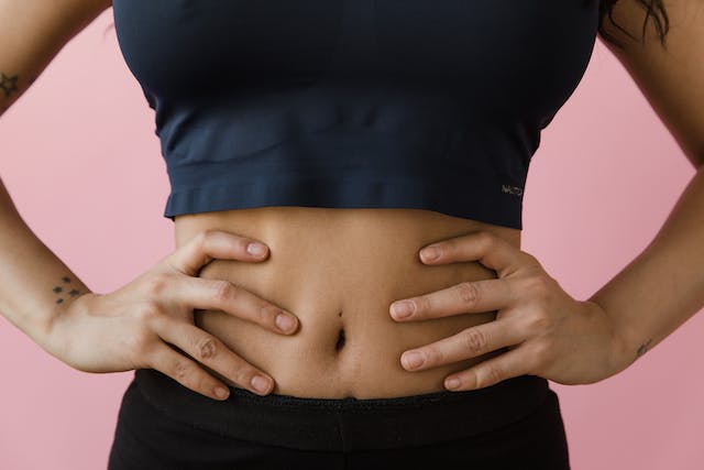 woman with hands on her stomach